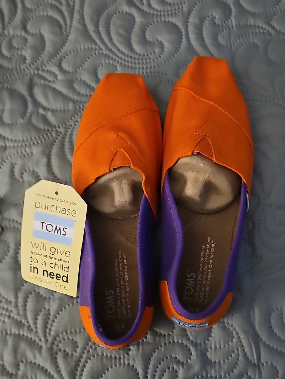 TOMS Women's Orange Canvas Slip-Ons with Purple Trim